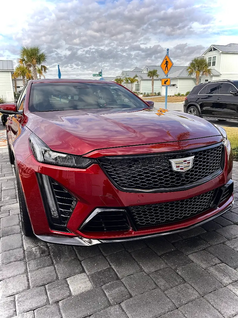 Car detailing Jacksonville FL - detailed Cadillac in residential driveway