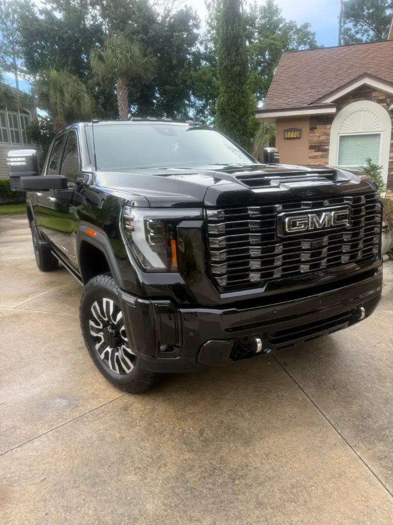 Car detailing Jacksonville FL - black GMC truck professionally detailed in residential driveway
