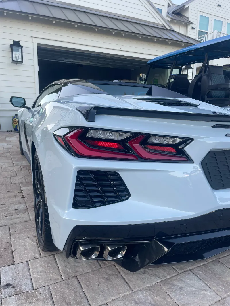 Car detailing Jacksonville FL - rear view of Corvette professionally detailed in owner's driveway